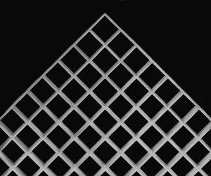 A close up of a white grid on a black background.