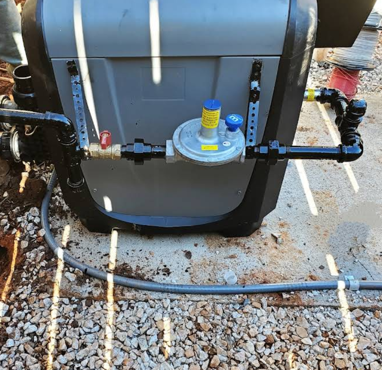 A gas valve is attached to the back of a machine