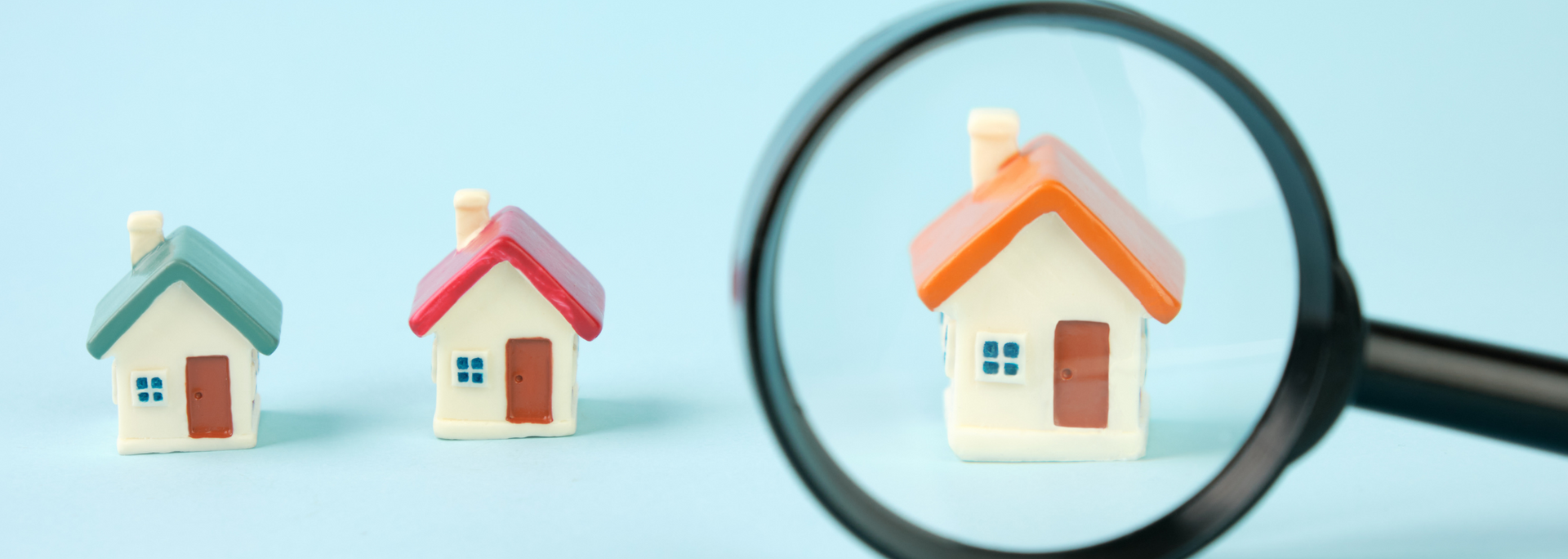 Picture of a house under a magnifying glass