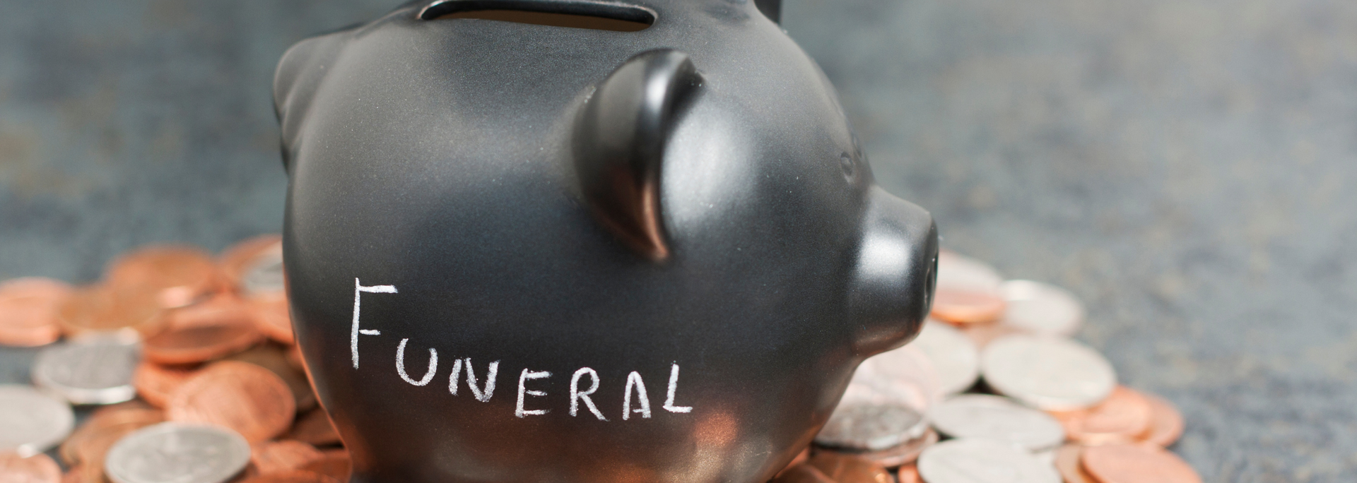 Picture of a piggy bank with funeral written on it