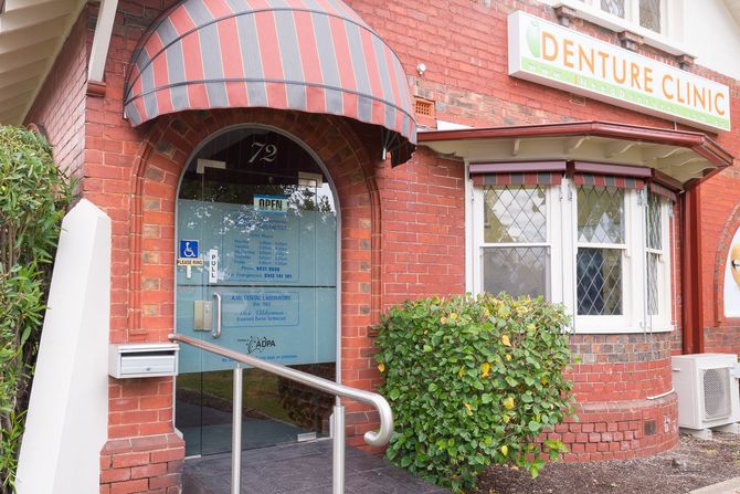 A dental office with a dental chair and a fireplace.
