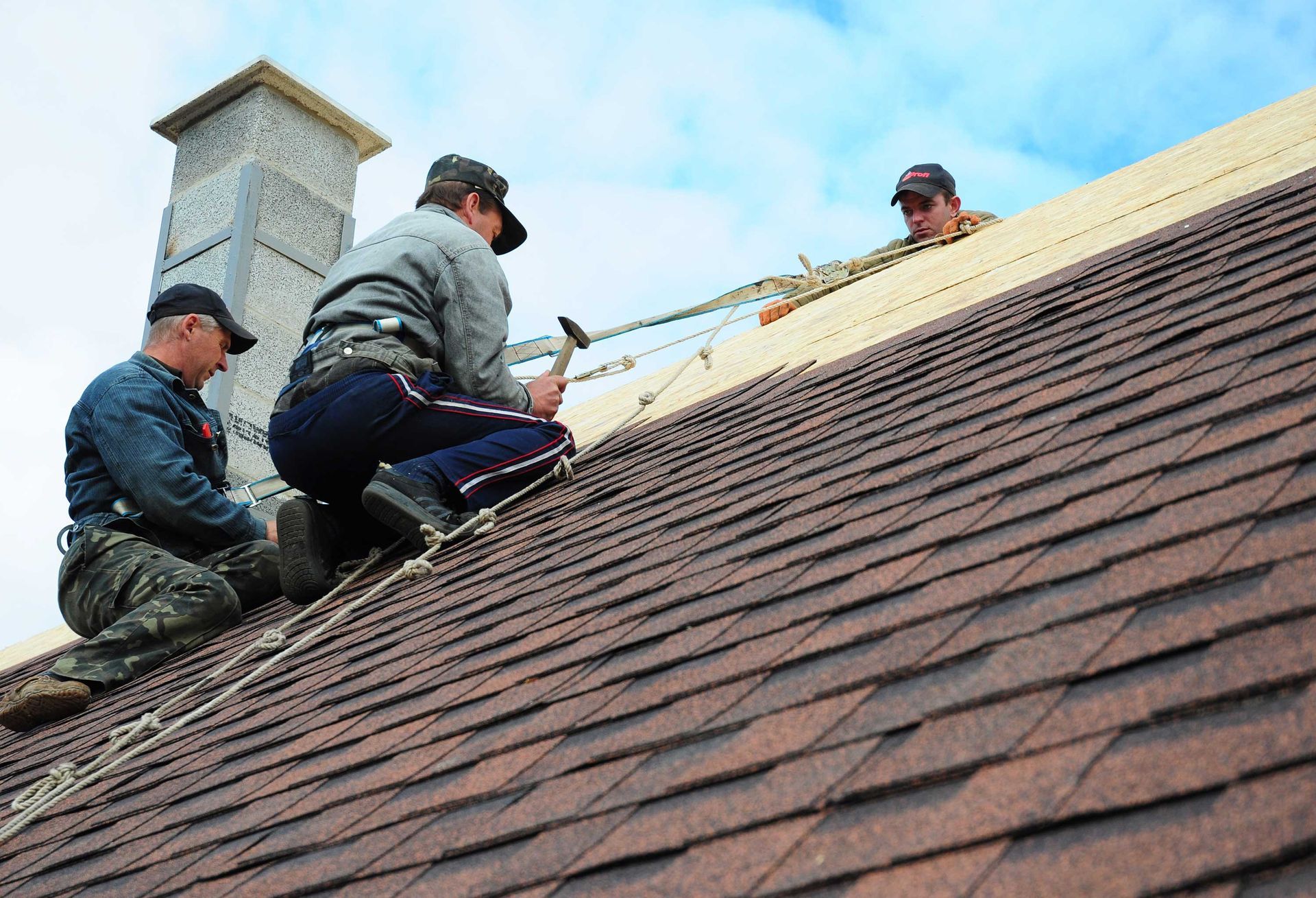 Men Installing Shingle Roof | White Bear Lake, MN | Bruggeman Exteriors
