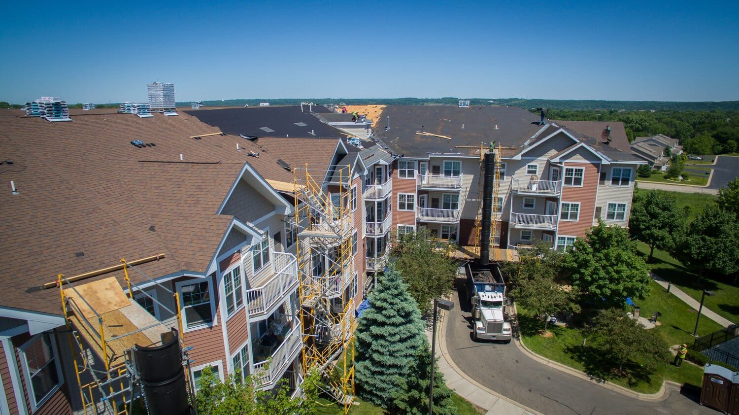 Scaffolding Attached to an Apartment Building | White Bear Lake, MN | Bruggeman Exteriors