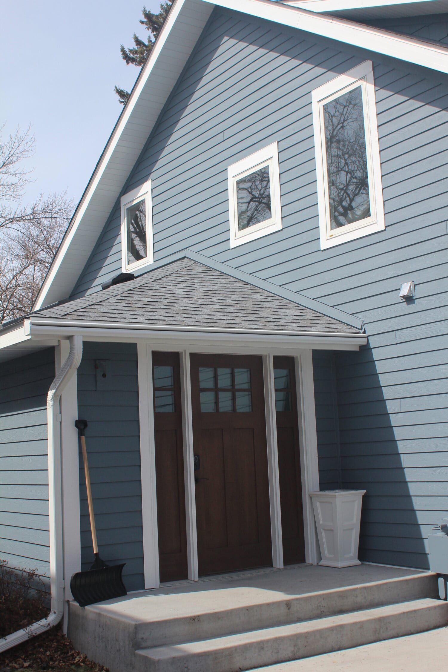 A Blue House with a Brown Door and Windows  | White Bear Lake, MN | Bruggeman Exteriors