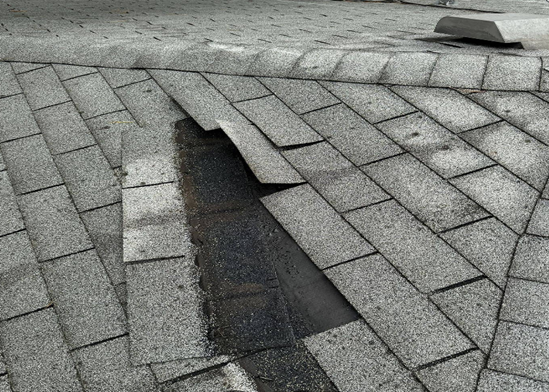 Hail and wind damage to shingles on a Saint Paul, MN home found by Bruggeman Exteriors