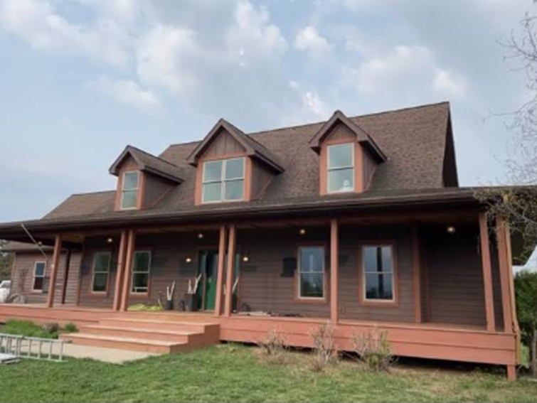 New siding from Bruggeman Exteriors on a Saint Paul, MN home, painted a rich brown color. 