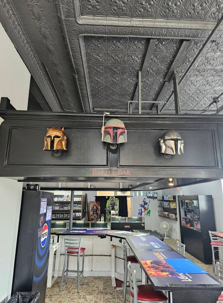 Three Mandalorian helmets mounted on a bar with a Star Wars theme.