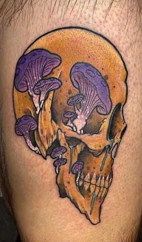 A tattoo of a skull with purple mushrooms growing out of it.