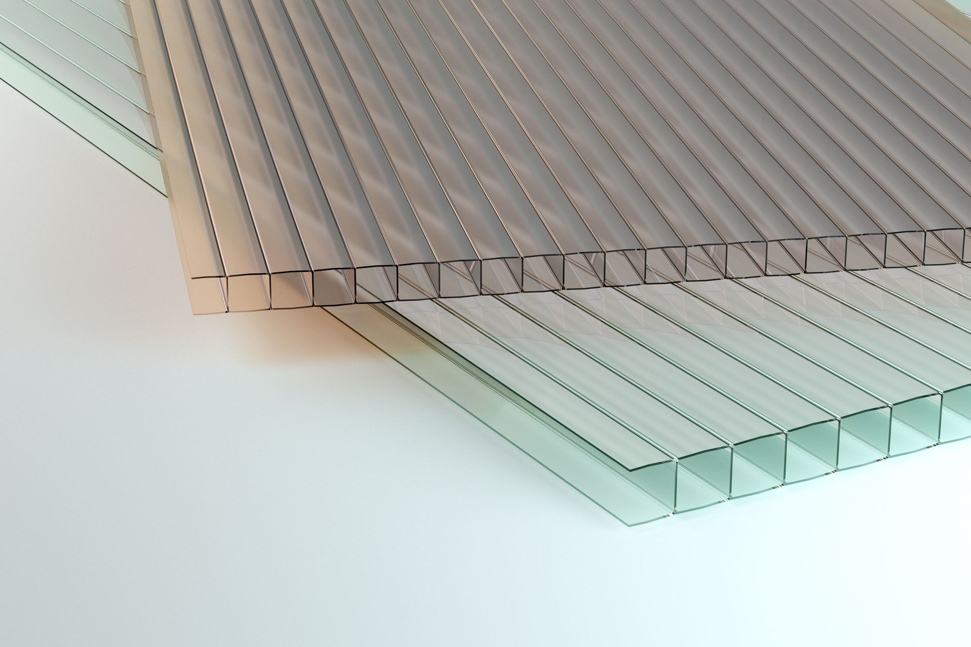 Clear and tinted multiwall Polycarbonate sheets stacked for durable construction and roofing.