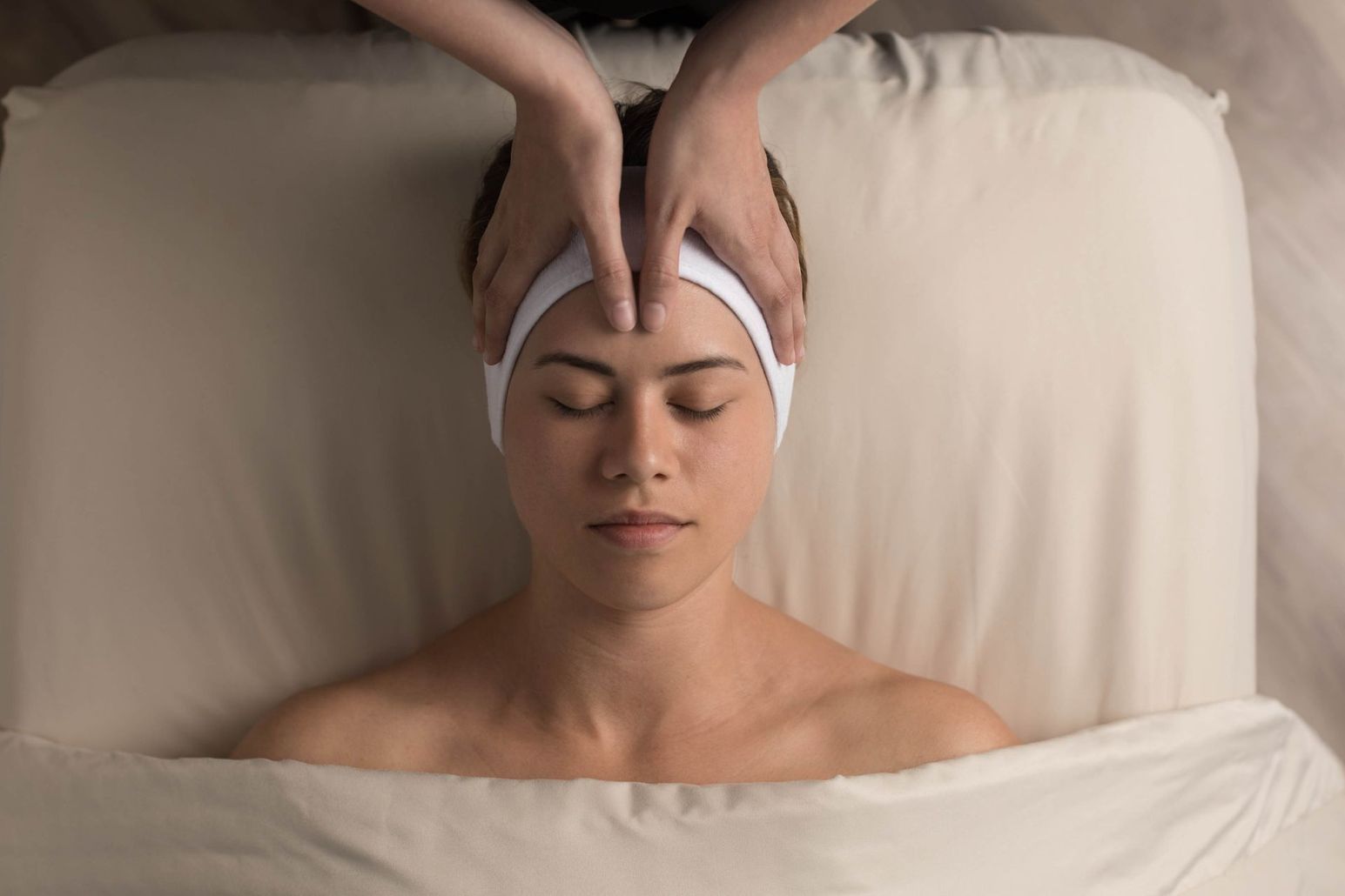 Guest receiving a relaxing facial treatment at Massage Heights