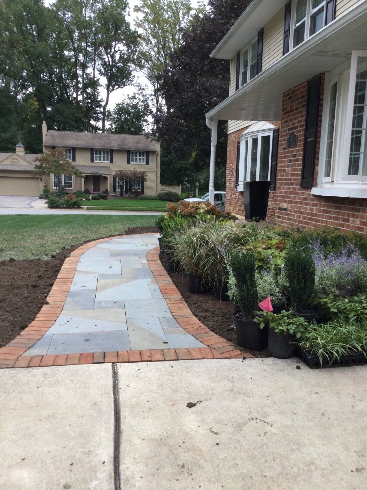 House Entrance With Stone Pathway Zoom Out — New Castle, DE — Ayala Landscaping