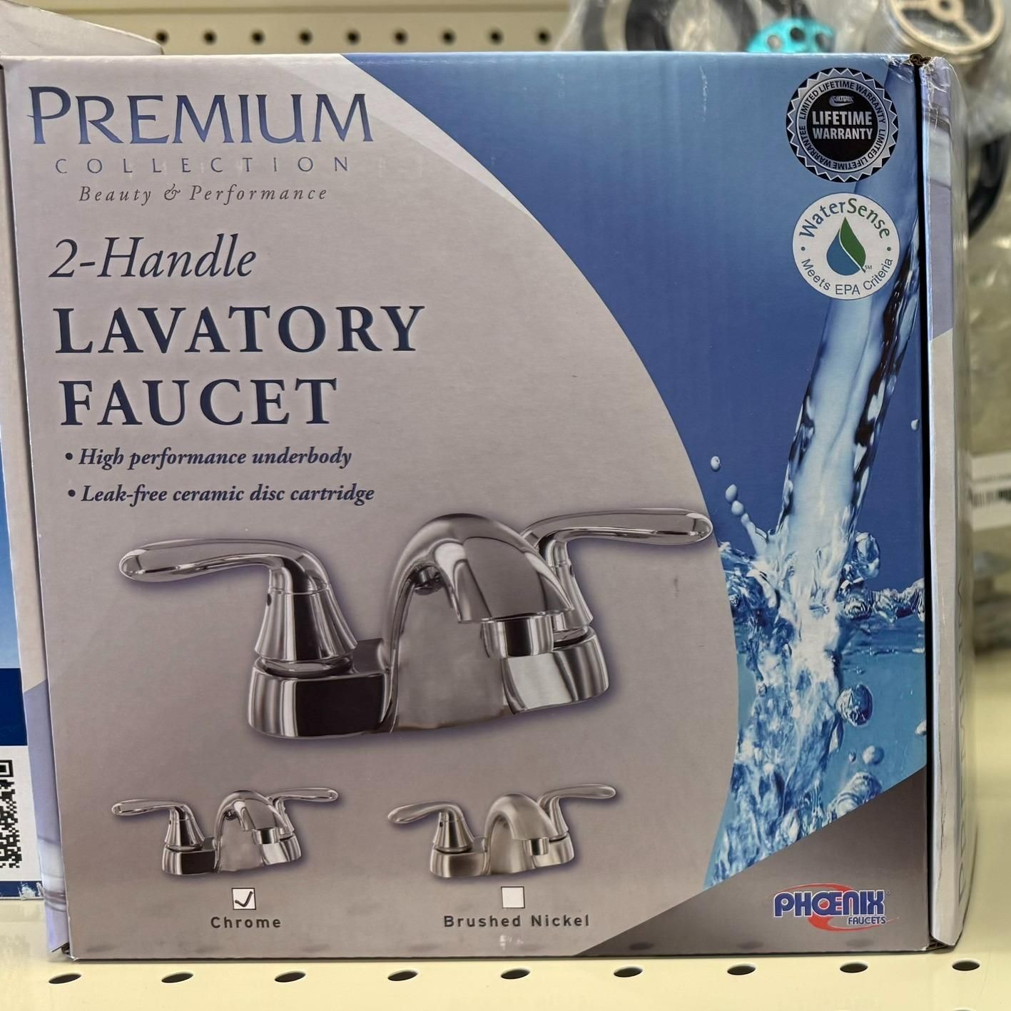 Boxed 2-handle lavatory faucet with chrome finish, water flowing graphic.