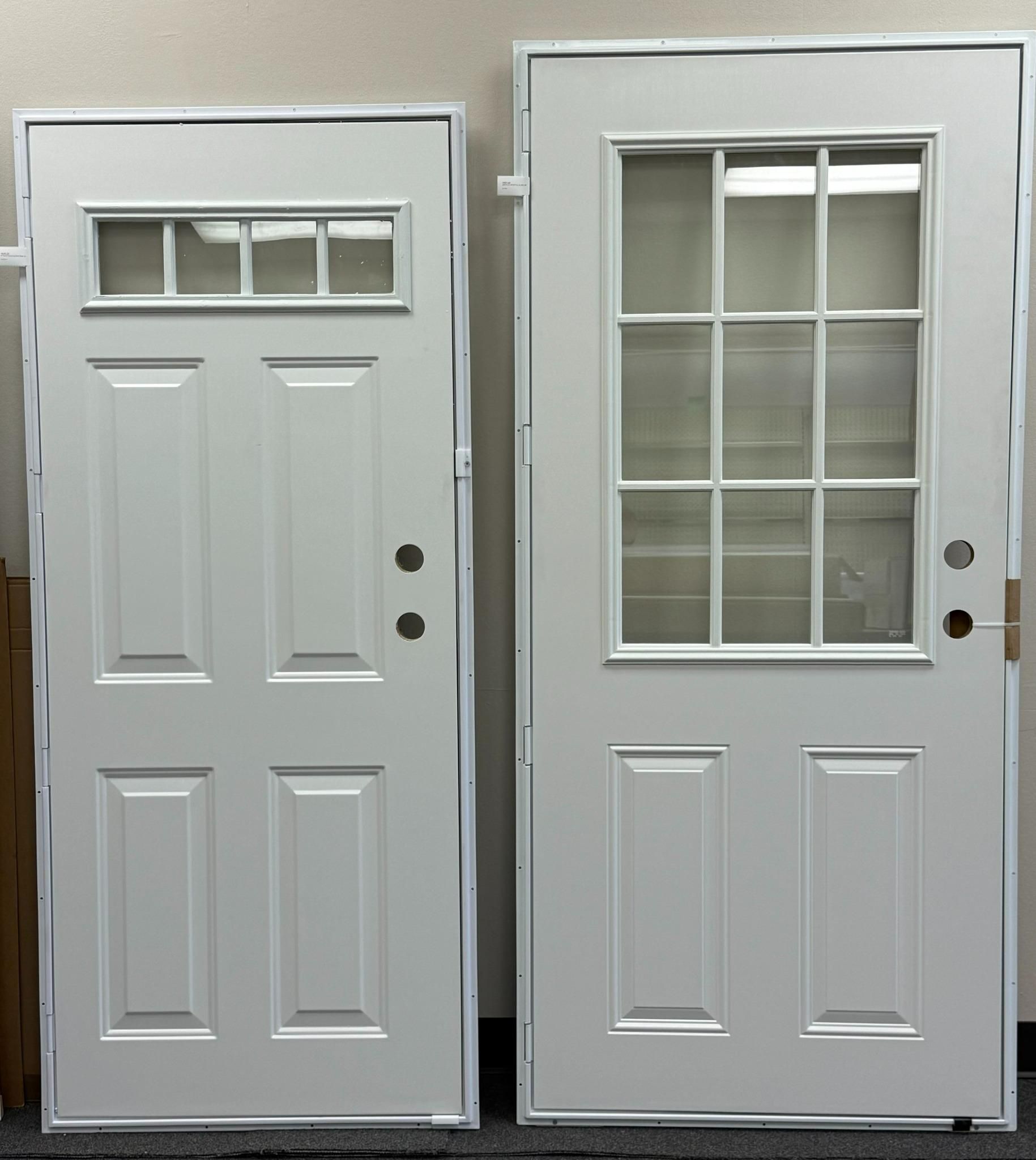 Two white exterior doors, one with window panes, the other with window and panel detail.