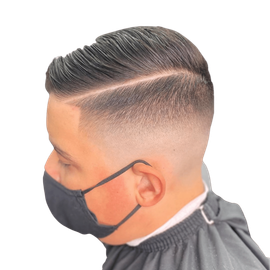 Low fade comb over gentlemen haircut by the professional barbers at Royal Fadez Barbershop.