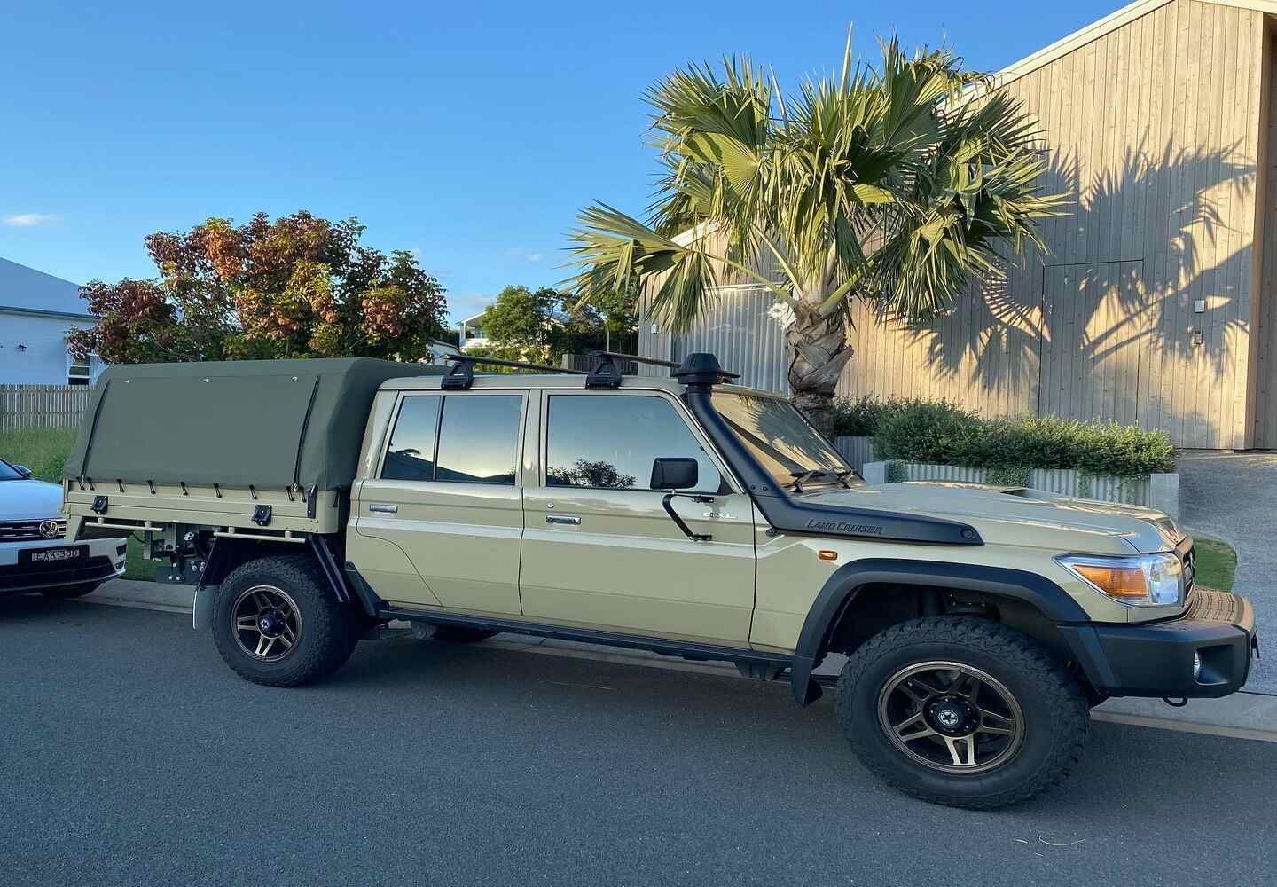 A Truck With A Canopy On Top Of It Is Parked On The Side Of The Road — Currumbin Trimmers  In Currumbin Waters, QLD