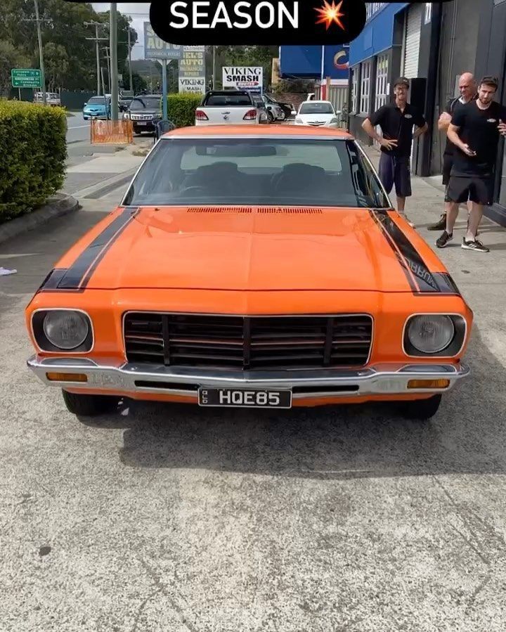 An Orange Car With A License Plate — Currumbin Trimmers  In Currumbin Waters, QLD