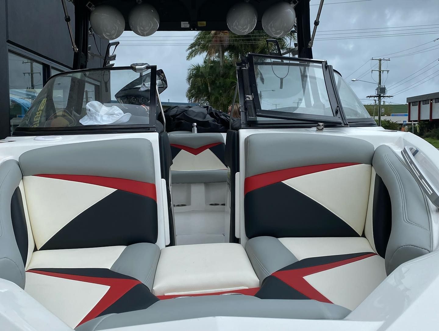 A White Boat With Red and Grey Seats — Currumbin Trimmers  In Currumbin Waters, QLD
