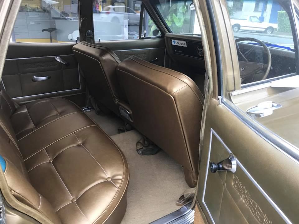 The Inside of a Car With Brown Leather Seats and a Steering Wheel — Currumbin Trimmers In Burleigh Heads, QLD