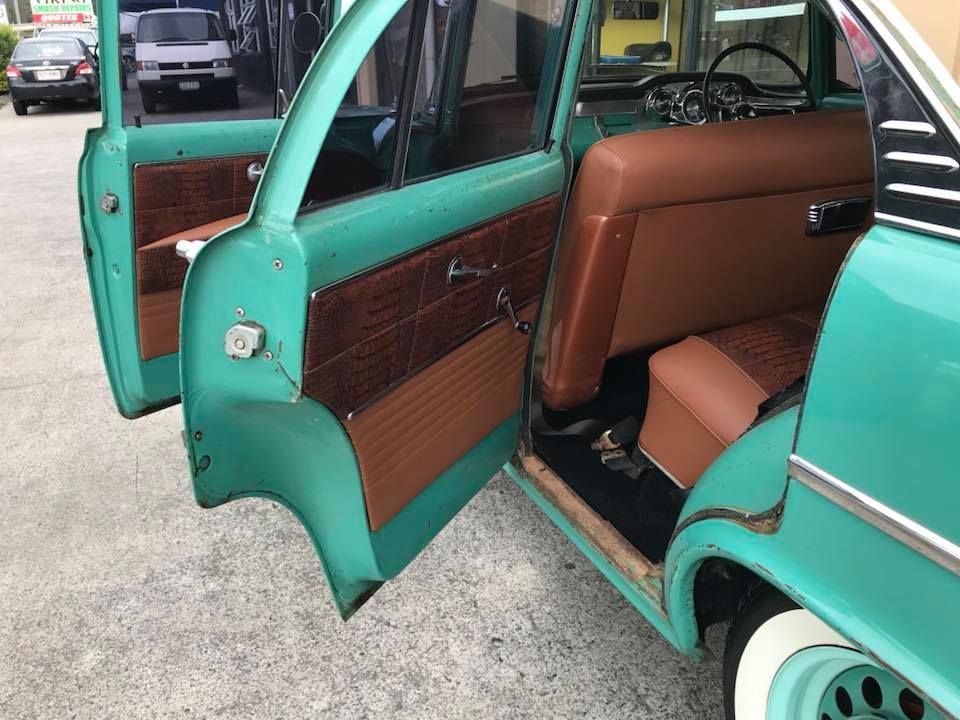 The Inside of a Green Car With the Doors Open — Currumbin Trimmers In Kingscliff, NSW