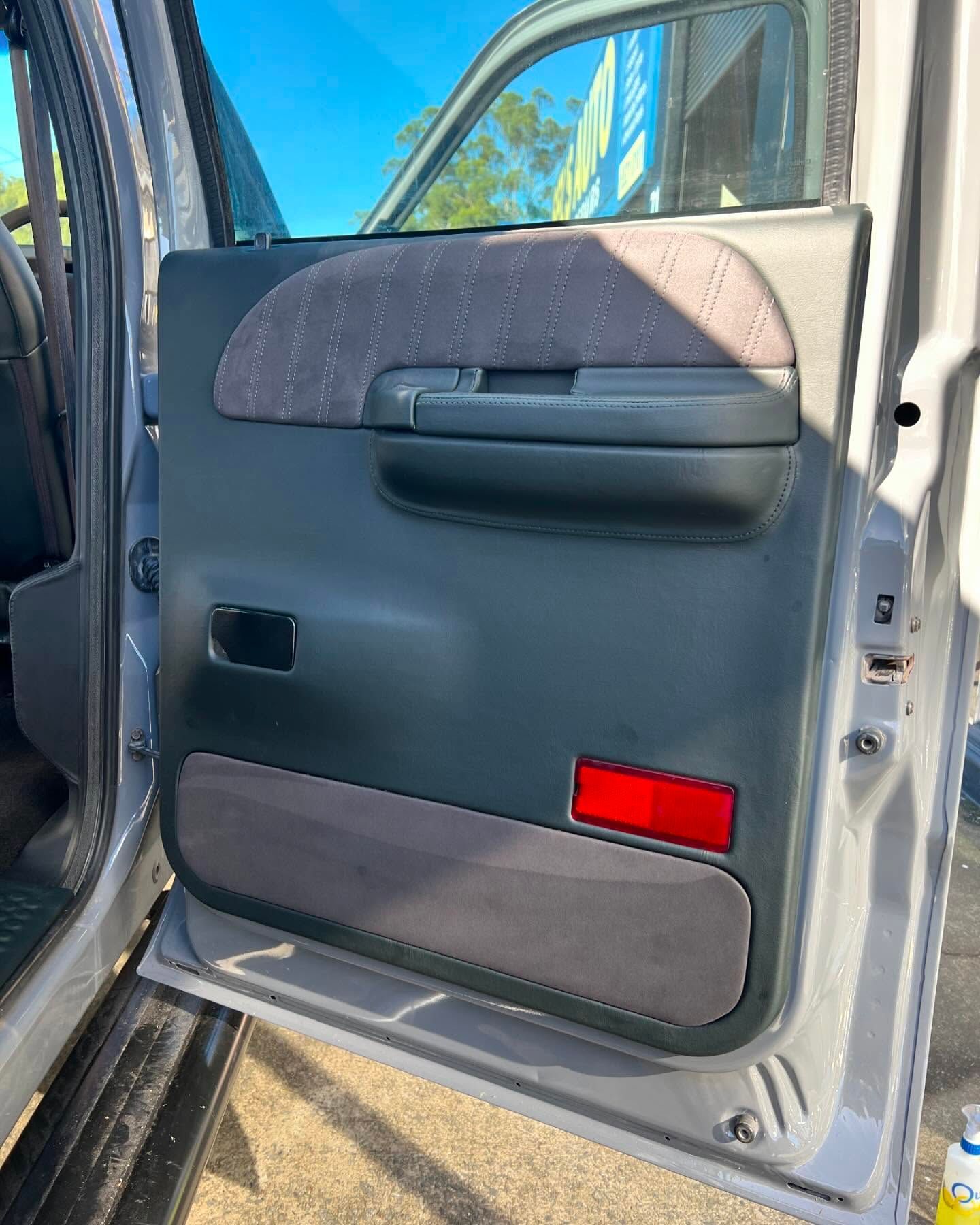 A Close Up of a Car Door With a Red Light on It — Currumbin Trimmers In Kingscliff, NSW