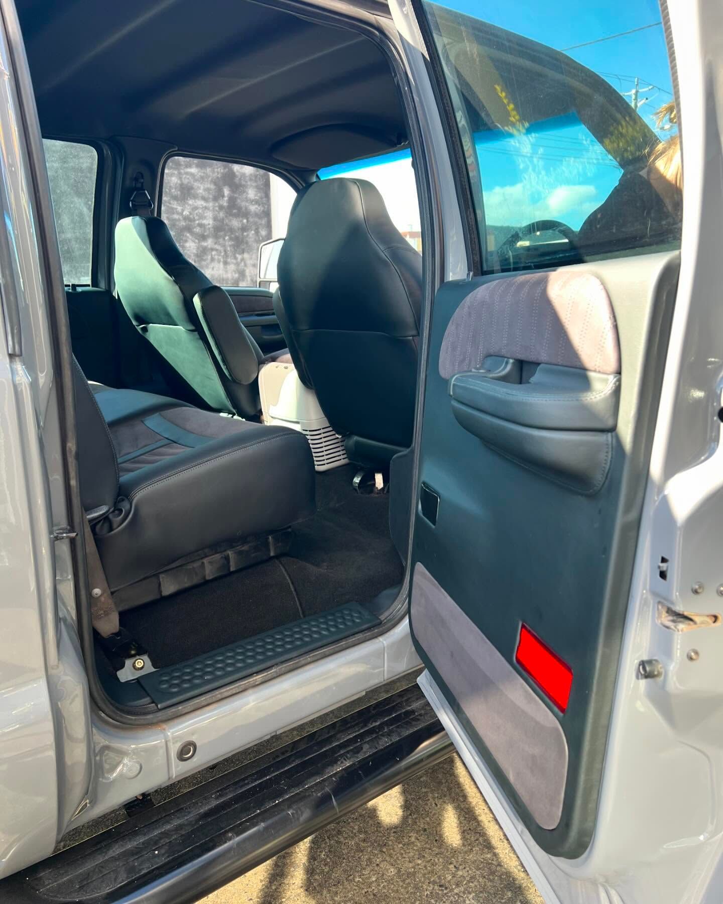 The Inside of a White Truck With the Door Open — Currumbin Trimmers In Byron Bay, NSW