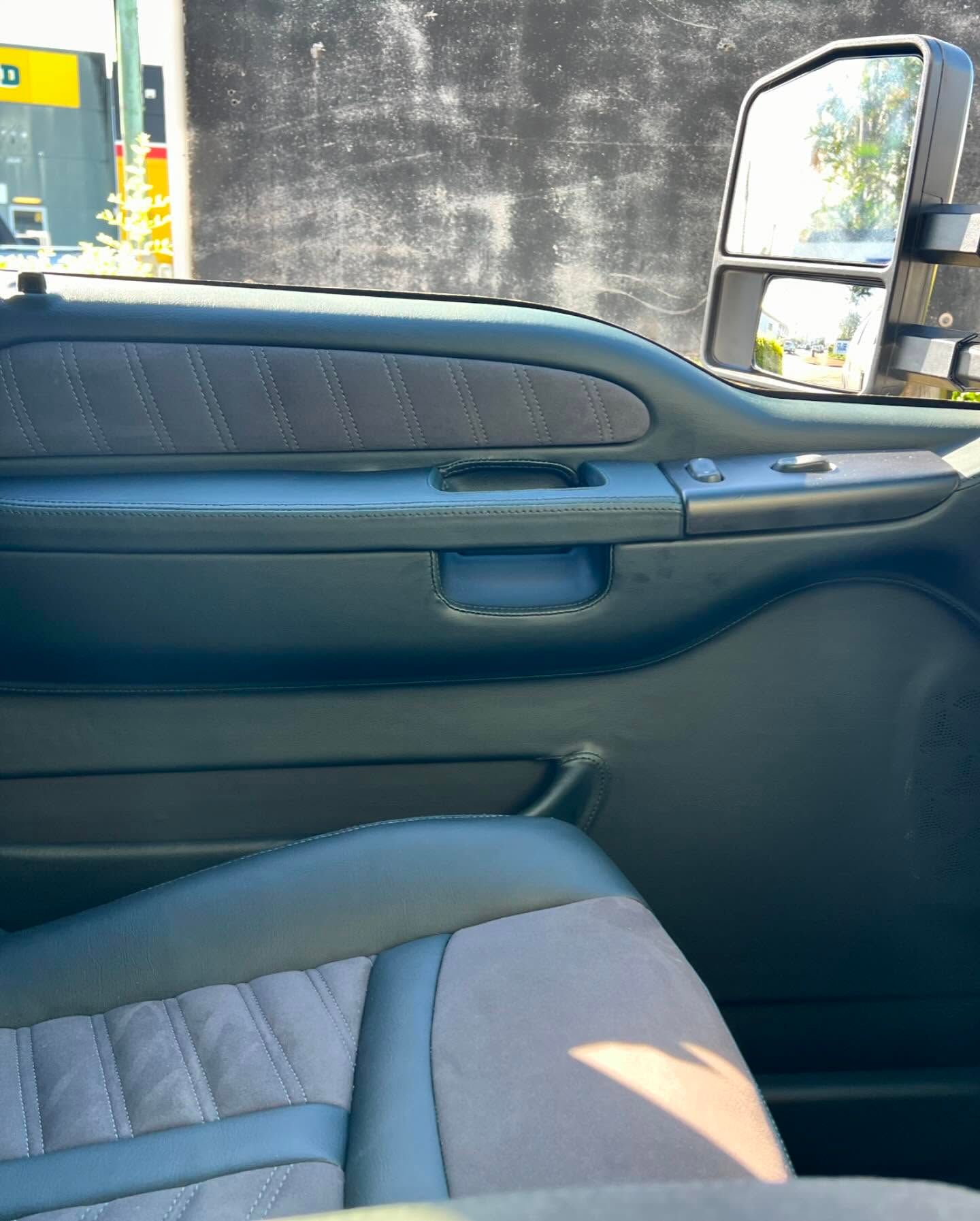 A Close Up of a Car Door With a Rear View Mirror — Currumbin Trimmers In Byron Bay, NSW