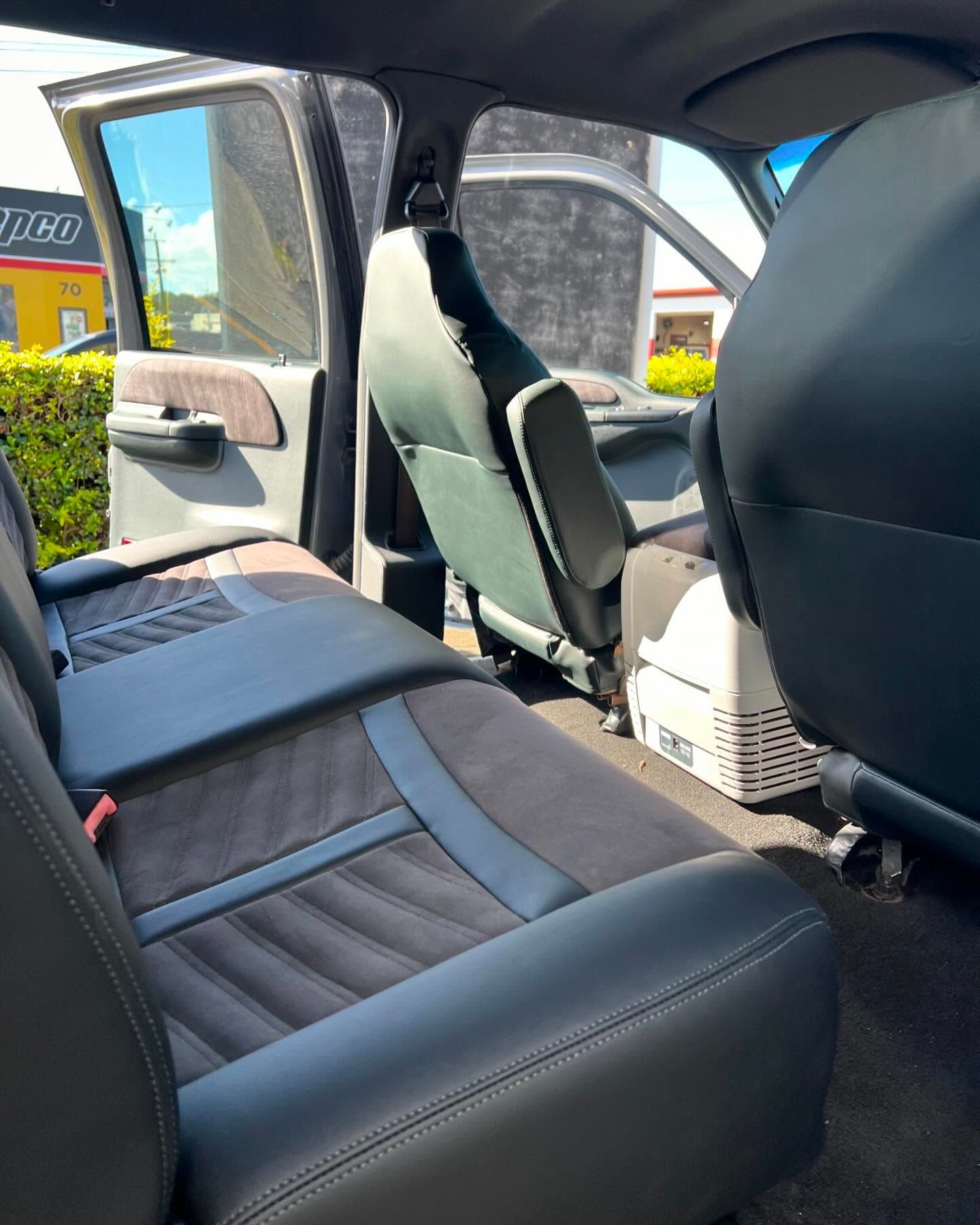 The Inside of a Car With the Door Open and the Seats Up — Currumbin Trimmers In Tweed Heads, NSW