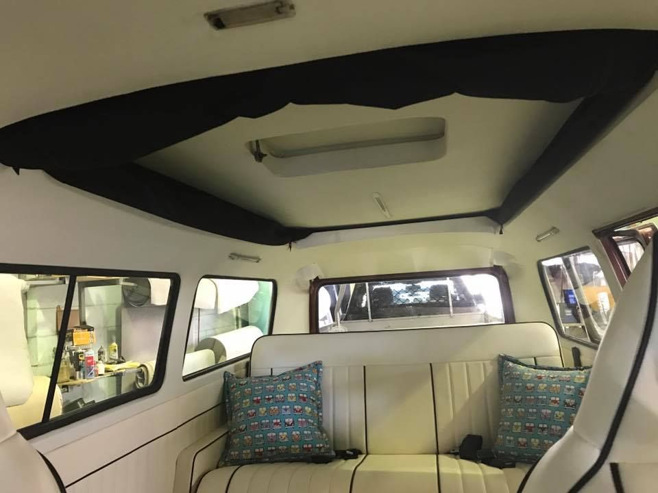 The Inside of a Van With a Couch and Pillows — Currumbin Trimmers In Murwillumbah, NSW