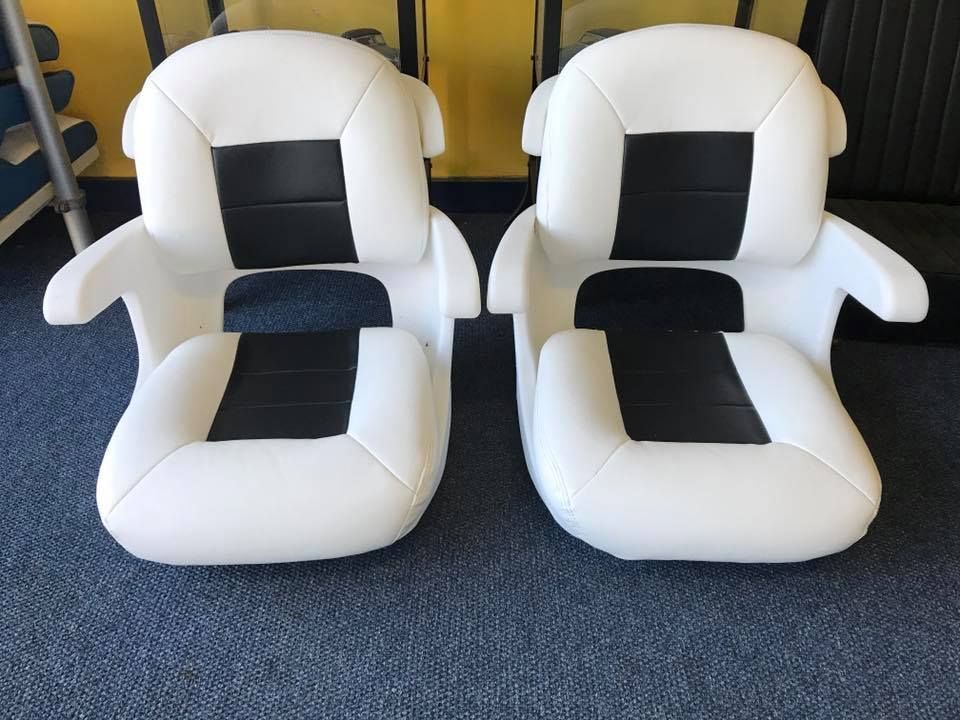 Two White and Black Chairs Are Sitting on a Blue Carpet — Currumbin Trimmers In Murwillumbah, NSW