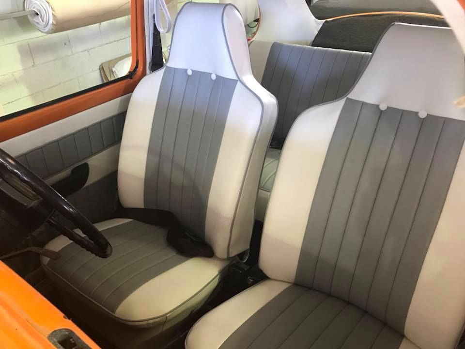 The Interior of a Car With Gray and White Seats and a Steering Wheel — Currumbin Trimmers In Murwillumbah, NSW