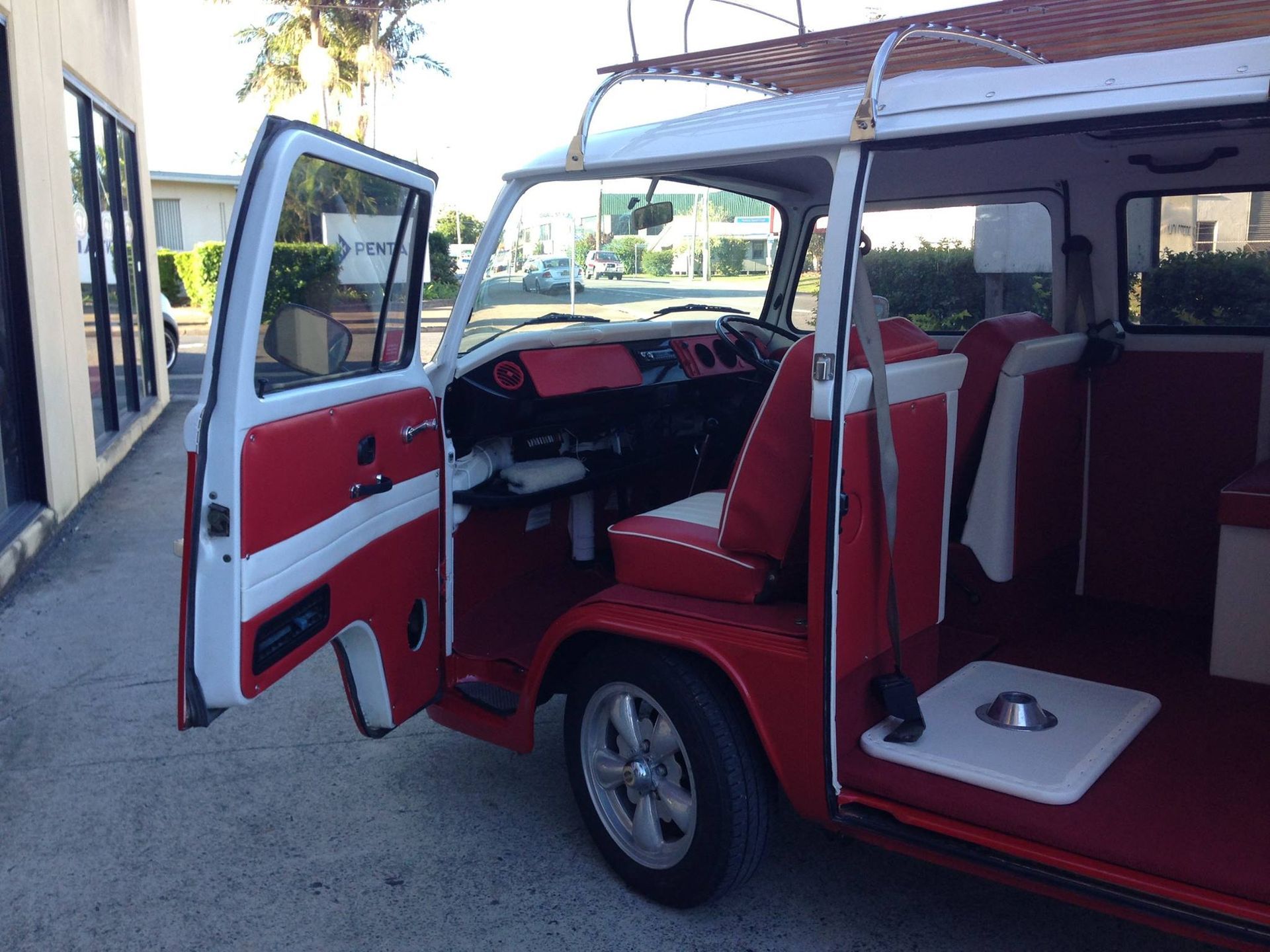 The Inside of a Red and White Van With the Doors Open — Currumbin Trimmers In Murwillumbah, NSW