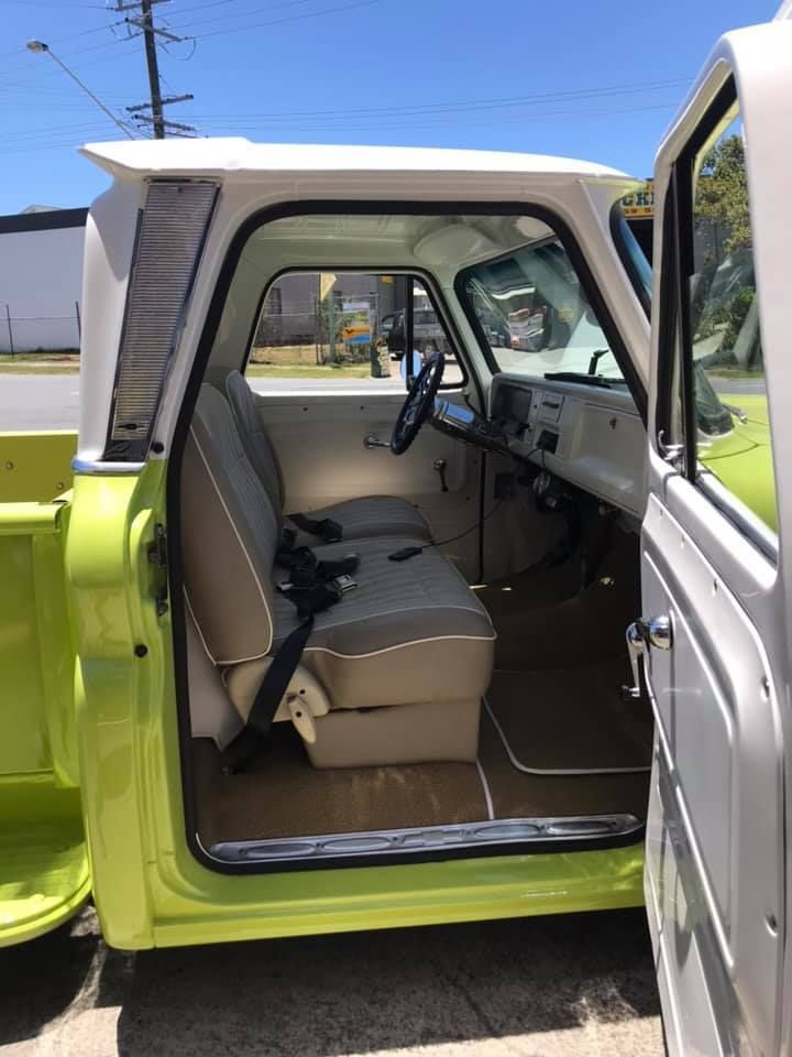 the Inside of a Green and White Truck With the Door Open — Currumbin Trimmers In Tweed Heads, NSW