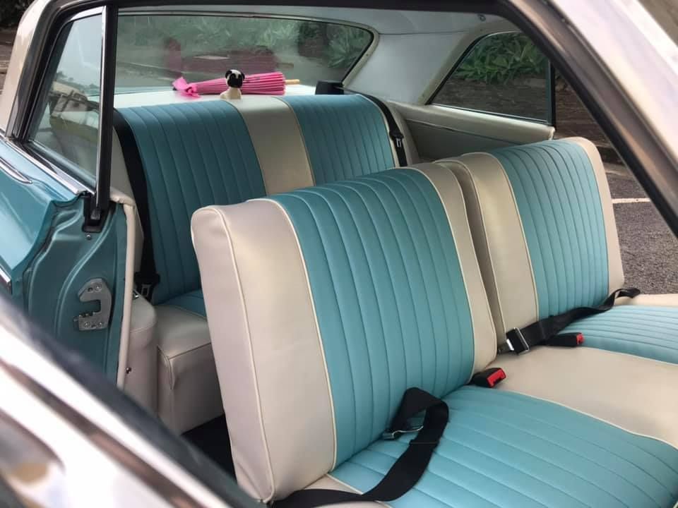 The Back Seat of a Car With Blue and White Seats — Currumbin Trimmers  In Currumbin Waters, QLD