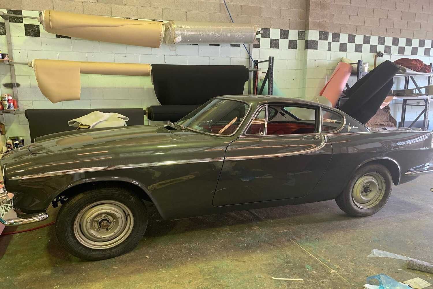 A Car Is Parked In A Garage With Its Hood Up — Currumbin Trimmers  In Currumbin Waters, QLD