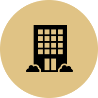 A black and white icon of a building with clouds around it.