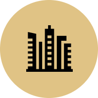 A city skyline icon in a circle on a white background.