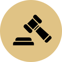 A judge 's gavel is sitting on top of a block in a circle.