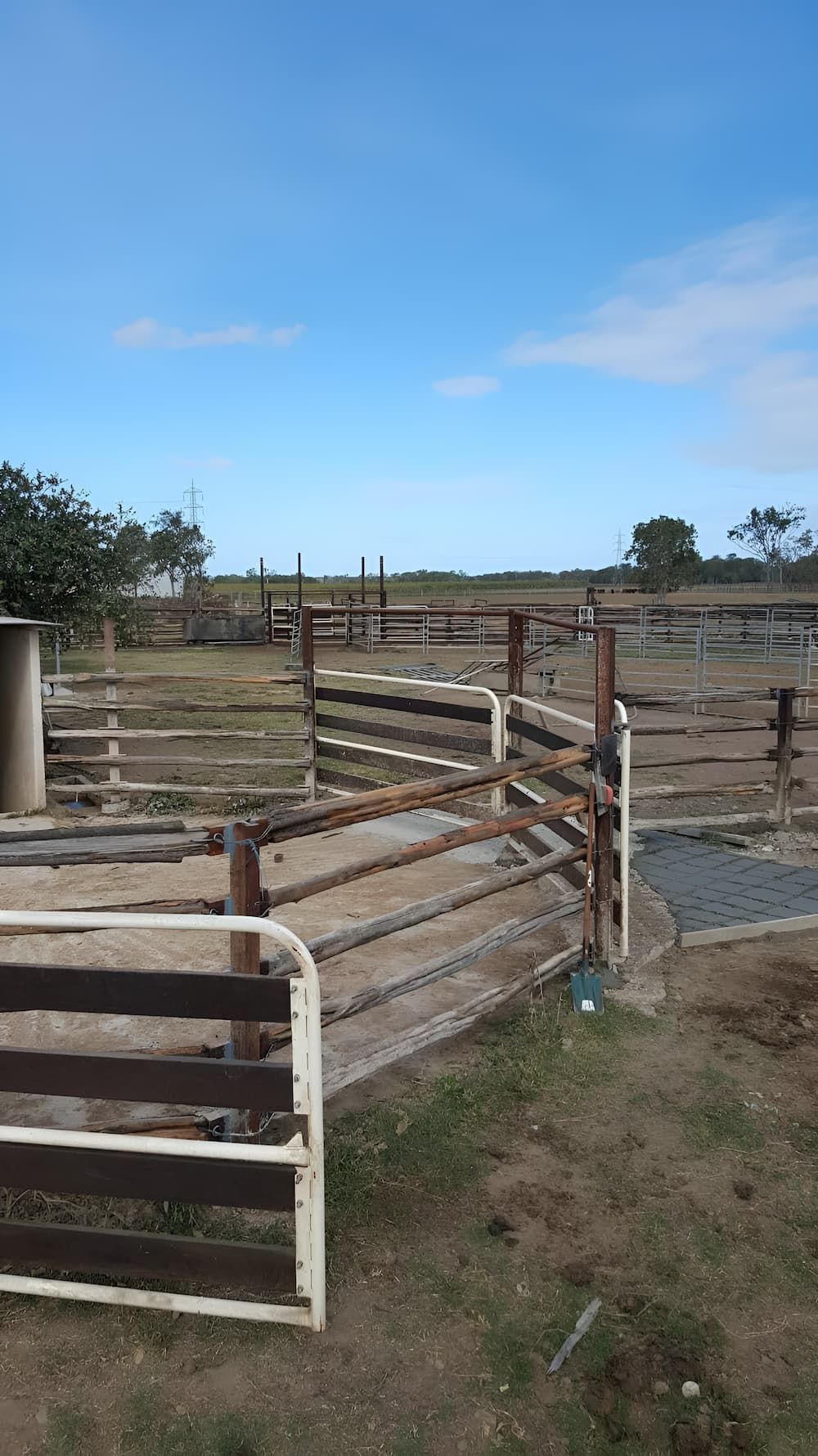 A Wooden Fence With A Gate In The Middle Of A Field — D.T. Fencing In Bakers Creek, QLD