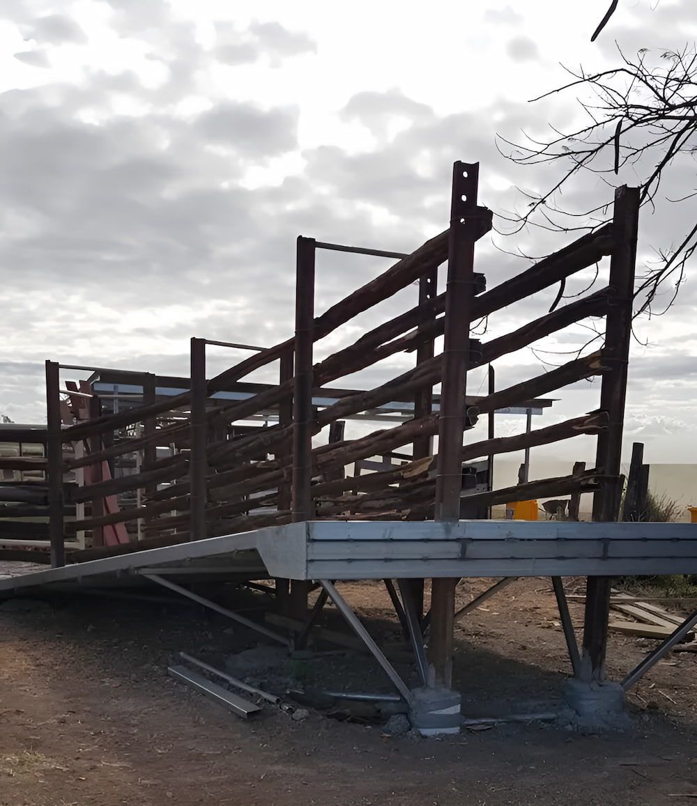 A Wooden Fence Is Sitting On Top Of A Metal Platform — D.T. Fencing In Bakers Creek, QLD