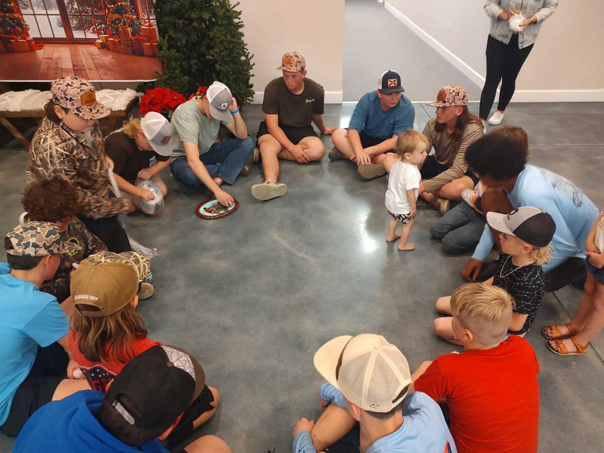 people are sitting in a circle on the floor