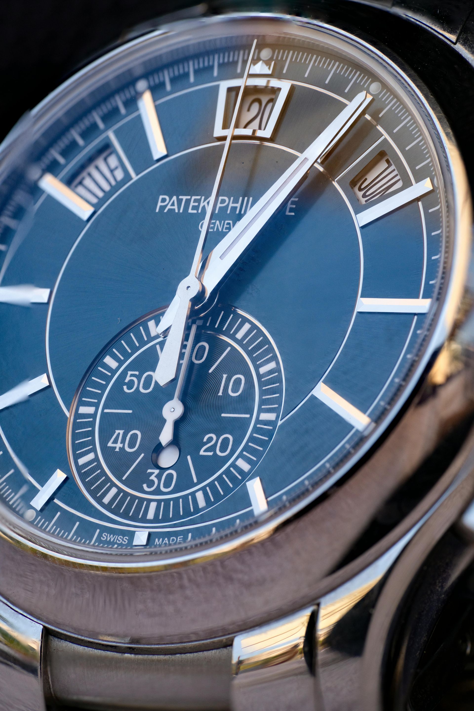 A close up of the face of a patek philippe watch