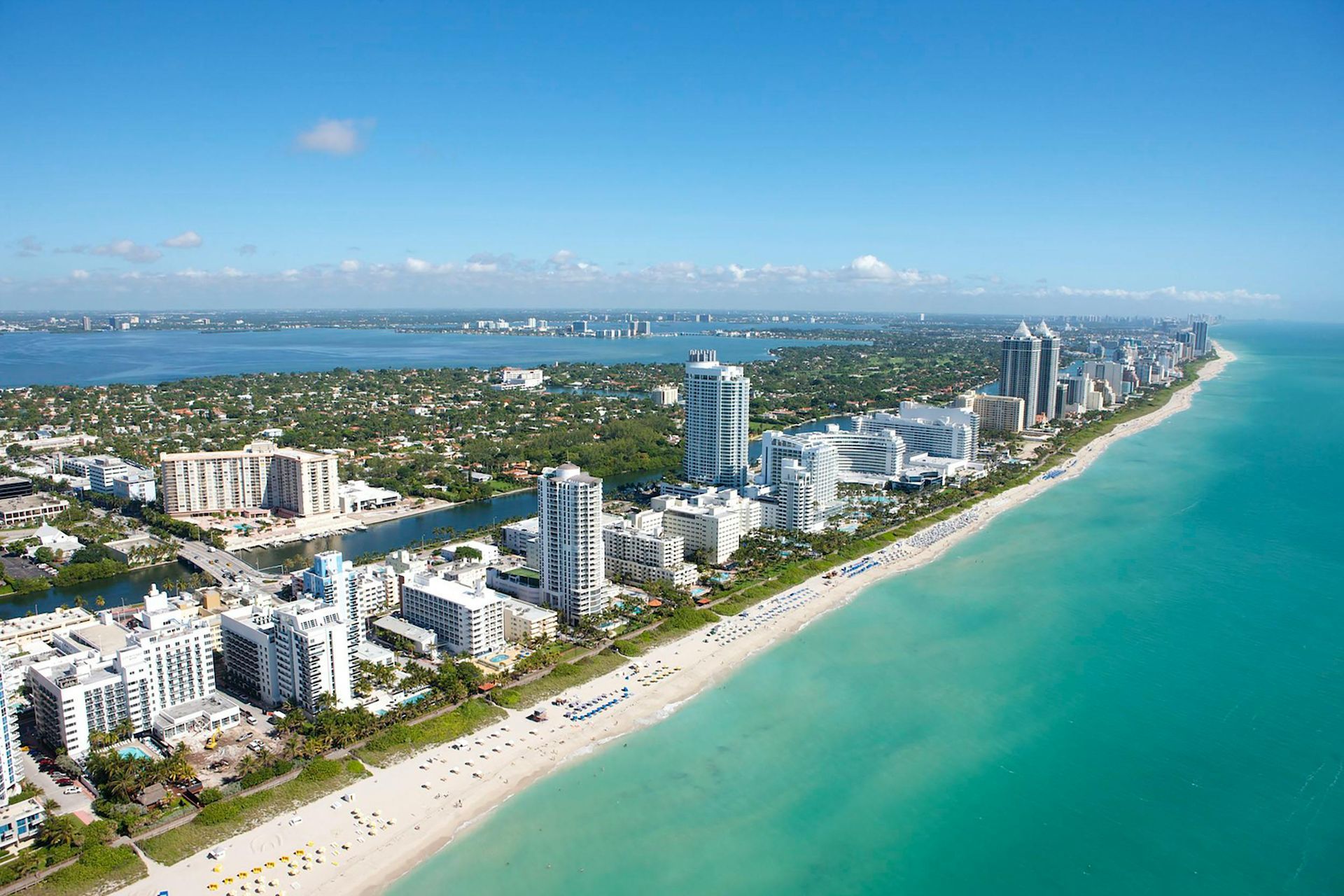 An aerial view of a city and a beach in florida.