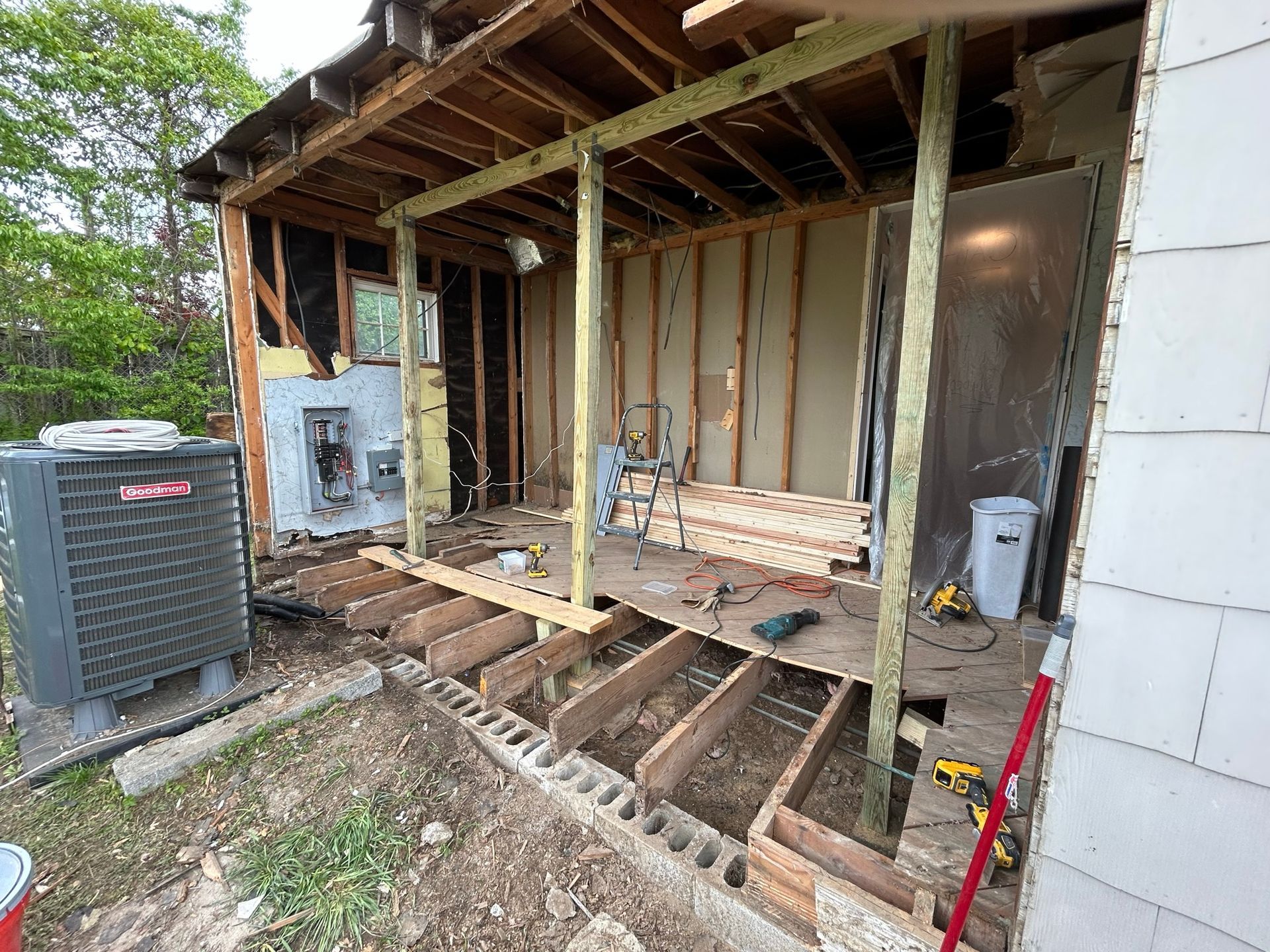 A house is being remodeled and a porch is being built.