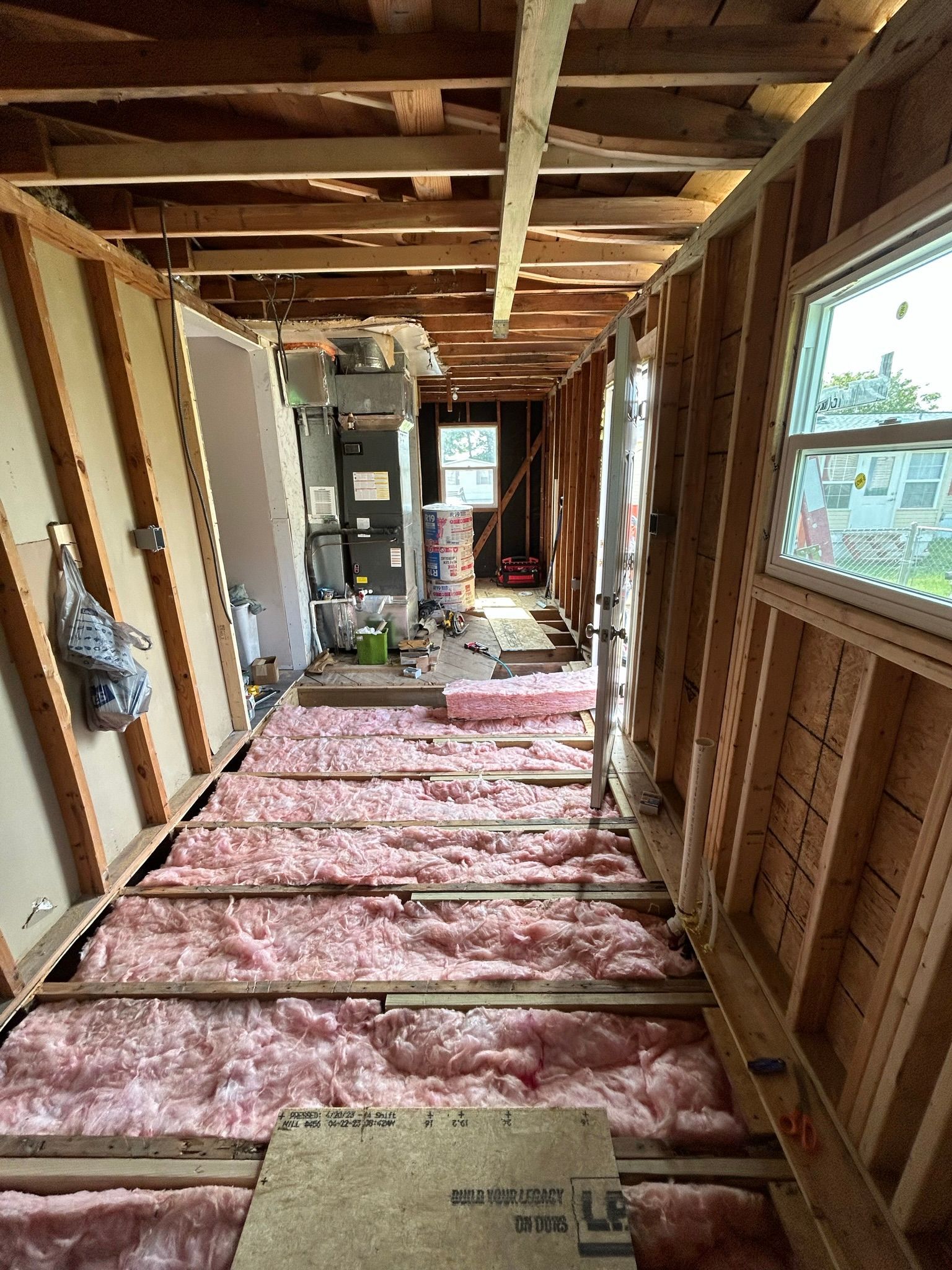 There is a lot of insulation on the floor of the house.