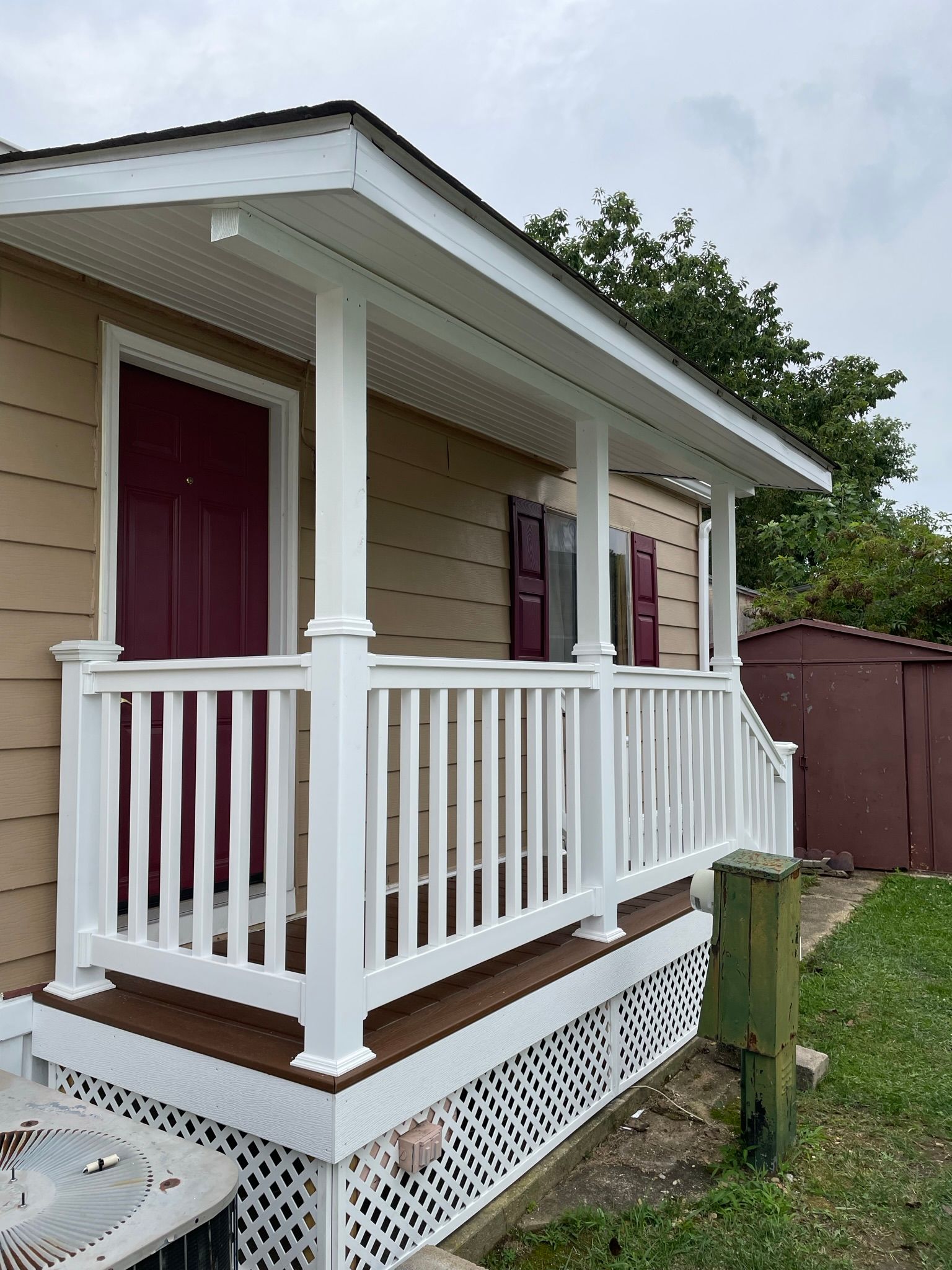 A house with a porch and a white railing