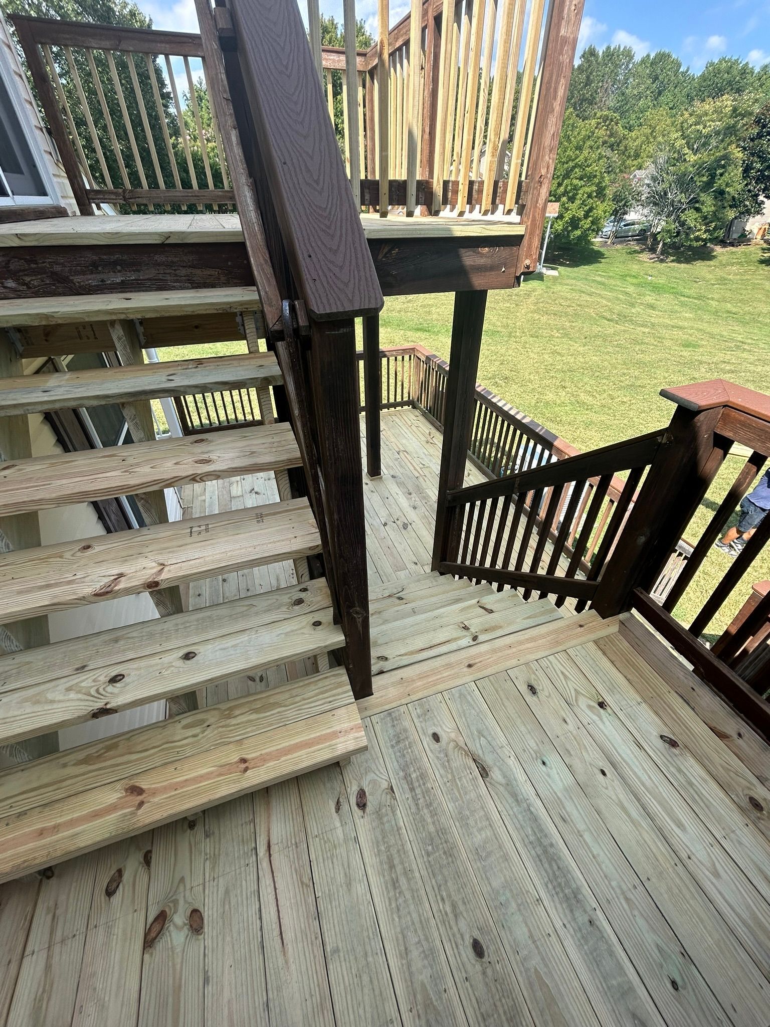A wooden deck with stairs leading up to it.
