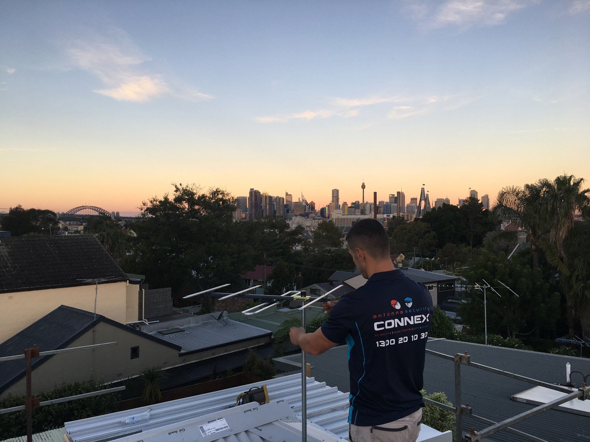 Man on the Roof Fixing Antenna — Greater Sydney, Nsw — Connex Antenna & Security