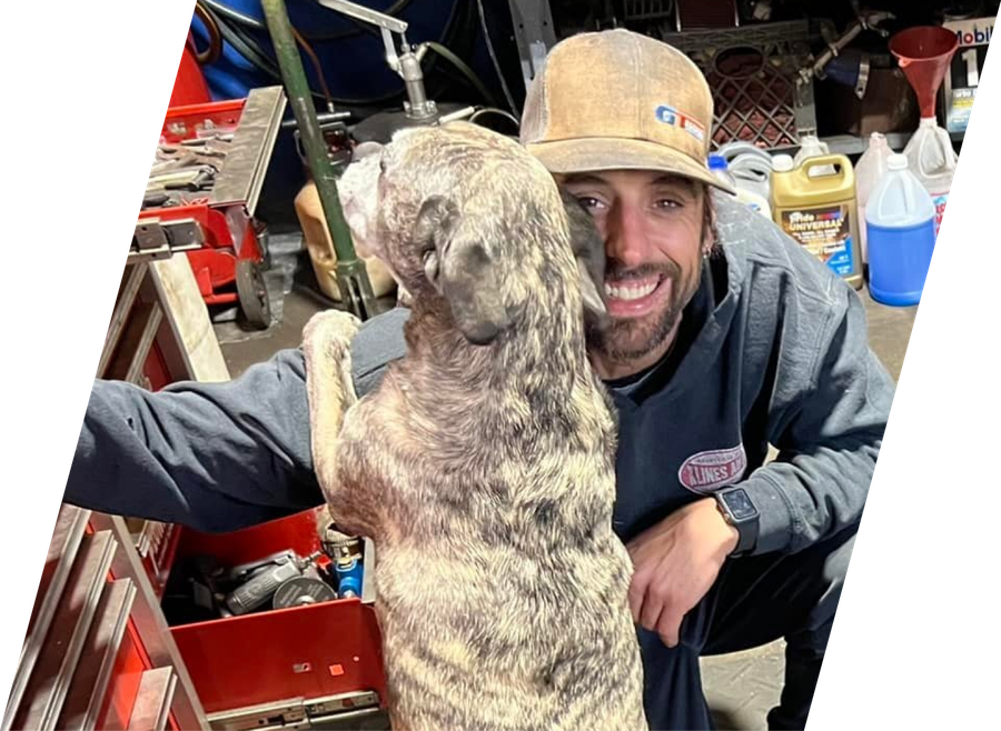 Team member and dog | A Team Automotive, LLC
