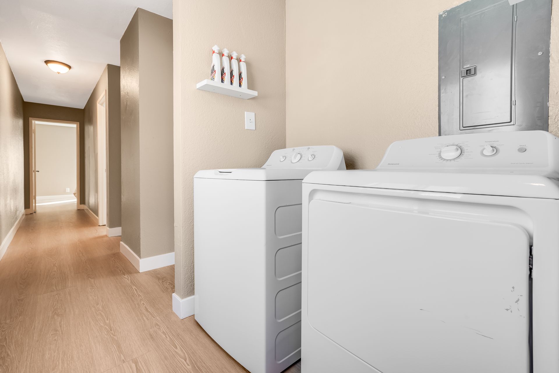 A laundry room with a washer and dryer in it.