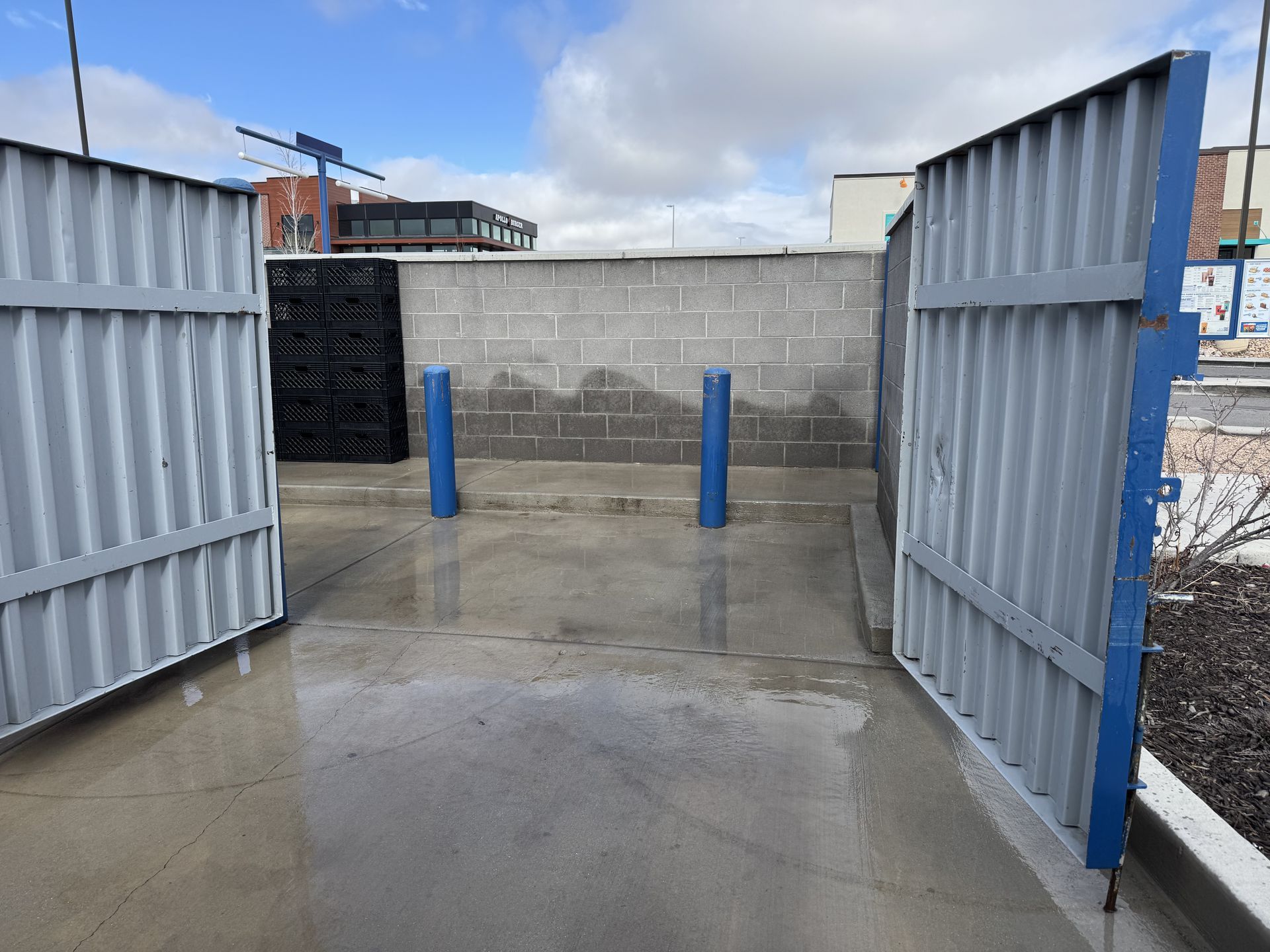 A clean dumpster pad that was pressure washed by Jet Dumpster & Exterior Cleaning